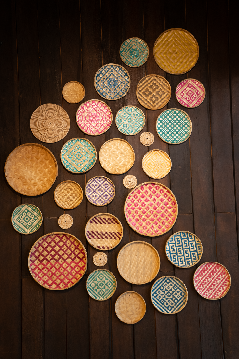 Hand-woven Shan baskets on dark wood — patterns and colors of upper Burma